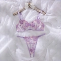 Detailed close-up of lavender floral embroidery on sheer mesh lingerie set on white silk - S / Light Purple
