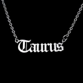 Close-up of Taurus gothic letter pendant on a polished stainless steel chain - Taurus-Silver