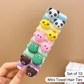 Close-up of 10-piece cartoon animal towel fabric elastic hair ties held on a card - Frog (10 Pcs)