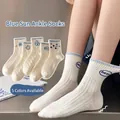 Five pack of cream cotton crew socks with blue hand-drawn sun and floral patterns - One Size / Blue Sun