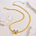 Collier élégant doré avec nœud en cristaux violets en forme de cœur sur chaîne plate - Collier Nœud Cœur Violet / Collier