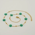 Bohemian gold stainless steel necklace featuring green crystal flower beads and gold accents - Necklace / Green
