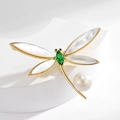Elegant gold dragonfly brooch with white wings, green gem and a pearl accent - Style 18