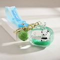Green panda liquid keychain with glitter, small bell, and Fruit Bears silicone strap - Rope Pendant Style / Green