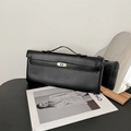 Detail of minimalist black PU leather handbag with elegant gold metal buckle closure - Black