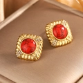 Detail of vintage square gold stud earrings with a red stone center and zircon accents - Square Rhinestone / Gold + Red Turquoise