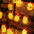 Christmas LED string lights featuring warm yellow glowing snowman with red hat and green scarf - Scarf Snowman