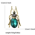 Vintage beetle insect brooch with emerald green glass stones and golden metal frame - Antique Gold Green