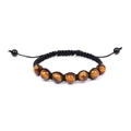 Close-up of natural brown tiger eye stone beads on a black woven adjustable bracelet - 7 Beads Tiger Eye Braided