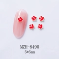 Macro view of MZH-8490 5x5mm red flower nail charms with golden base and enamel finish - Red Flower (8490)