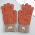Detail of knit touchscreen gloves featuring warm fleece lining and orange-grey color block - Orange