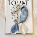 Elegant blue and white silk scarf with moon and arrow patterns in a looped knot - 70x70cm / Crescent Moon Chevron-Blue