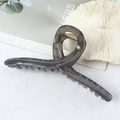 Large grey matte hair claw clip for thick hair shown on white fabric background - Transparent Texture / Gray