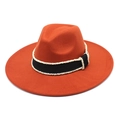 Detail of rust red wool fedora hat featuring a black grosgrain ribbon with white beaded trim - M (56-58cm) / Caramel color