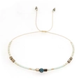 Bohemian woven adjustable bracelet with light blue beads and a dark blue faceted stone - Pale Cyan Gold Blue Mixed