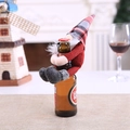 Christmas bottle topper featuring a red plaid gnome with a white beard on a glass bottle - Red Body Forest Man