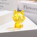 Gros plan d'une figurine de dragon en verre ambré translucide pour décoration de bureau - Dragon du Zodiaque / 5cm / Jaune d'Or