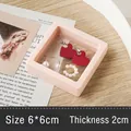Pink PE film jewelry display box 6x6x2cm with floating earrings and rings on desk - Square Film Suspension Box (7*7) / Pink