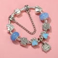 Detailed view of silver charm bracelet with cat paw pendants and my best friend tag - Sl023318/1216-4