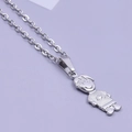 Macro shot of silver stainless steel pendant featuring a minimalist smiling boy silhouette - Boy Necklace - Silver
