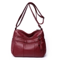 Crossbody bag in burgundy PU leather with multiple zipper pockets and adjustable strap - Red