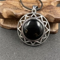 Hexagram ster ketting met ronde zwarte edelsteen en zilveren achthoekig frame - Obsidiaan