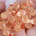Miniature orange resin duck figures in translucent finish for DIY crafts and decor - Light Orange