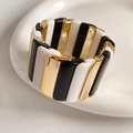 Detailed shot of elastic block bracelet featuring black, white, and gold geometric segments - Black, White & Gold Splicing