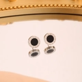 Detailed view of silver stainless steel studs with black inlay and Roman numeral engraving - 10mm / Steel