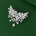 Elegant silver butterfly pearl brooch with sparkling zircons on dark green background - Silver