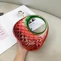 Red and green gradient acrylic shell clutch with diamond pattern and circular handle - Red & Green