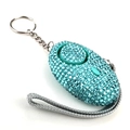Detail of blue rhinestone personal security alarm with silver keychain and grey lanyard - Emerald Green