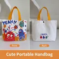 Cartoon canvas tote bag in cream white with yellow handles and colorful monster prints - Funny Carnival-White
