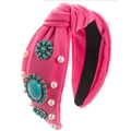 Dettaglio di fascia bohémien rosa con nodo, pietre turchesi e decorazioni in perle - Perla Rosa Rosso