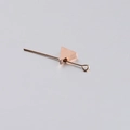 Macro shot of rose gold triangle charm bead and metal bar for DIY jewelry making - Rose Gold