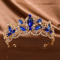Luxury Baroque gold crown with deep blue crystals and diamonds on brown satin - Sapphire Blue