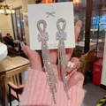 Silver bow knot earrings with long rhinestone tassels and S925 silver needles - Dense Bowknot Rhinestone Tassel (E0350) 925 Sterling Silver Earring Post