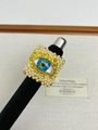 Macro detail of vintage evil eye square ring with gold texture and pearl border - Blue Eye Pearl Square Ring