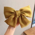 Elegant large mustard yellow satin bow hair clip with a smooth silk texture for women - Spring Clips / Ginger Yellow