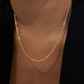 Sparkling gold-plated stainless steel star chain necklace for women on a model - 40+5cm / Gold