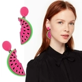 Detailed view of acrylic watermelon slice earrings with creative bite design on a model - Watermelon Slice