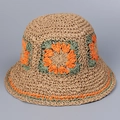 Detail of hand-woven straw hat featuring colorful floral crochet patterns and scalloped edges - Orange