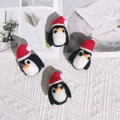 Set of four handmade wool felt penguin ornaments with red Christmas hats for DIY gifts - Penguin / White