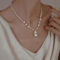 Close-up of Baroque pearl pendant necklace on model's neck with natural lighting - Baroque Irregular Pearl Style (10# Necklace-White)