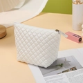 Elegant white quilted makeup bag with zipper closure and portable travel design - Trapezoid Bag / White