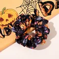 Detail of Halloween hair scrunchie with orange pumpkin and owl patterns on black fabric - No. 3 Large Scrunchie / Large Size