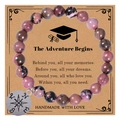 Detail of pink rhodonite beaded bracelet with compass charm on adventure gift card - Adventure Begins / Agate