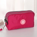 Magenta canvas telefoontasje met drie ritsvakken en een afneembaar polsbandje - Rose Rood Klein