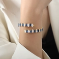 Double-layered gold-plated bangle with alternating blue and white marquise-cut zircons - Blue Zircon Gold Color
