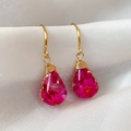 Close-up of handmade resin teardrop earrings with pink dried flowers and gold wire - Style 2 (HE31316) / Pink